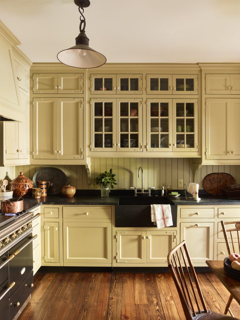 The kitchen of a restored Charleston carriage house, with wrought-iron hinges and wooden knobs (Photo Eric Piasecki)