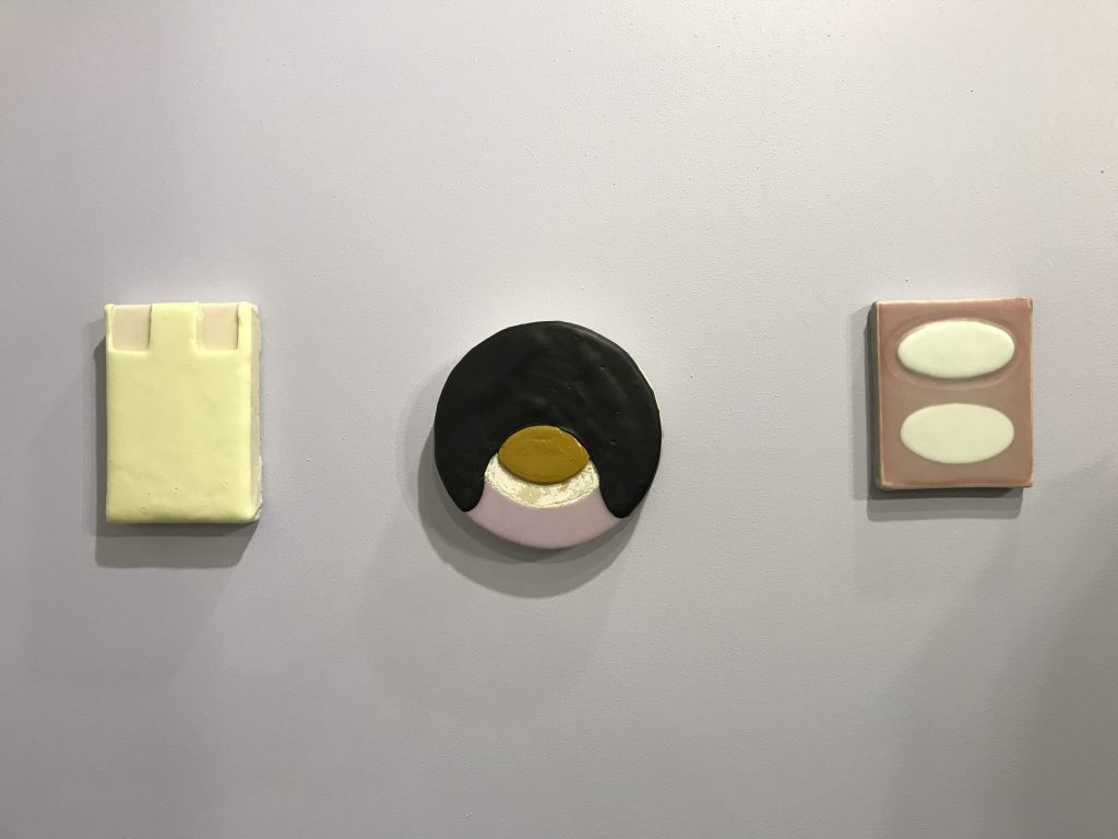 A wall of cheeky paintings by Bret Slater at Liliana Bloch Gallery, making her Dallas Art Fair debut.