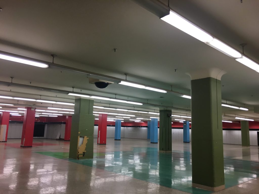 The higher floor has vestiges of its cheery, colorful former life. 