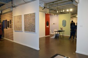 Two photographs by the Dallas artist Leigh Merrill at Liliana Bloch Gallery in a dialogue with the chic wallpapered walls of McClain Gallery, in from Houston.