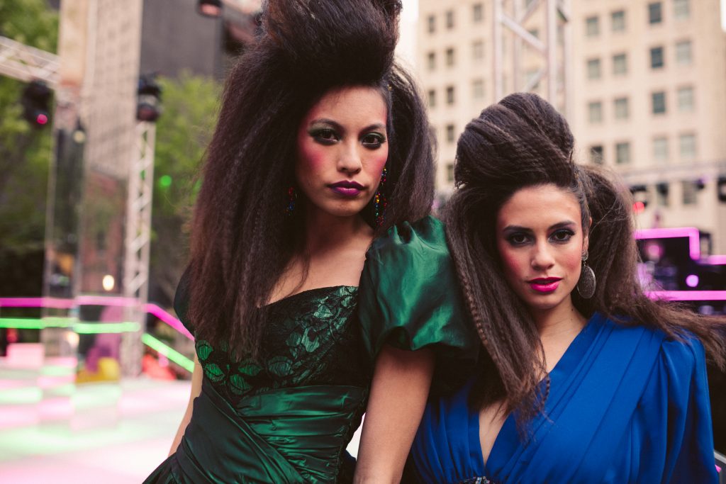 Models dressed in '80s costumes mingled throughout the party.