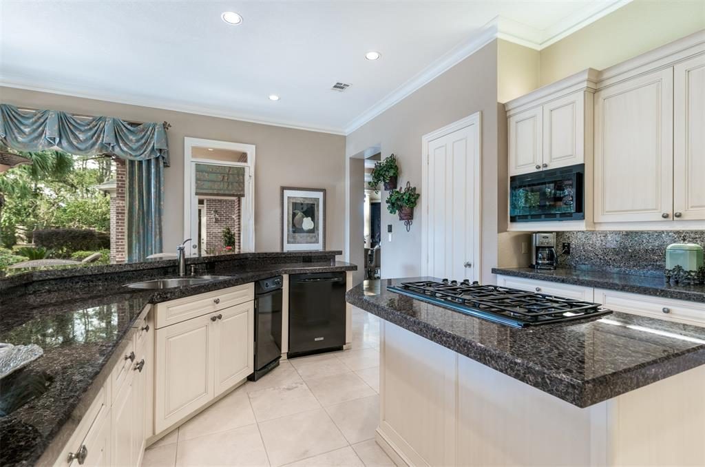 The Wood-Mode cabinetry in the kitchen is lined with lights. 