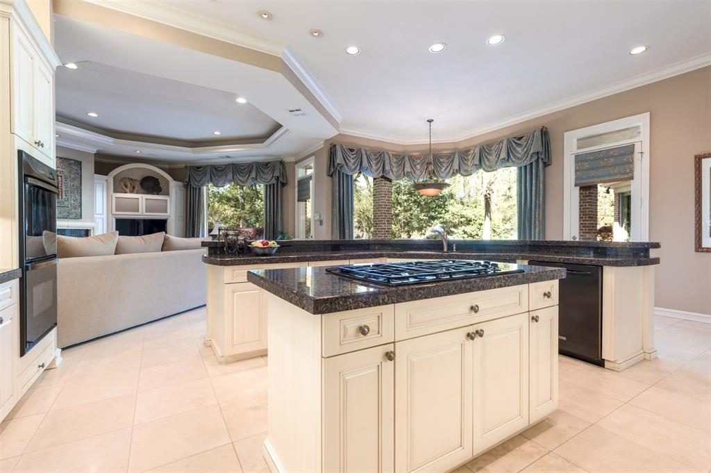 Two islands and a raised bar make the kitchen the perfect place for party prep. 