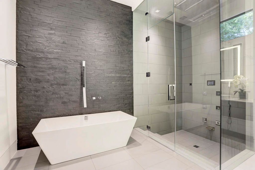 The master bath features the soaking tub and a sleek glass shower. 