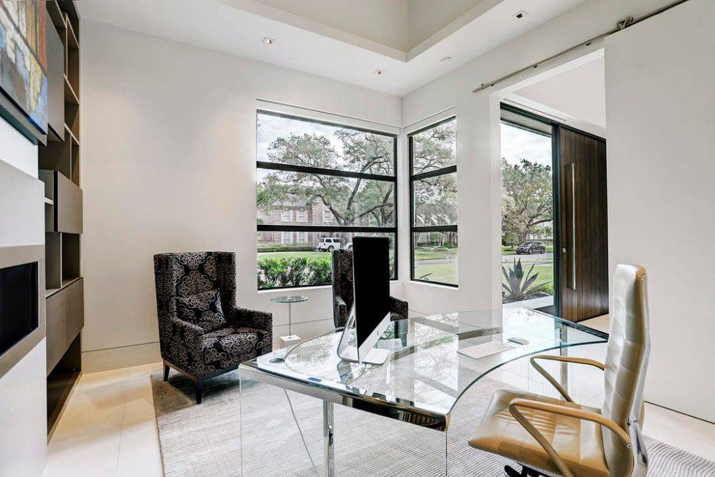 The study has lovely storage space, with bespoke Eggersmann cabinetry around the linear fireplace.