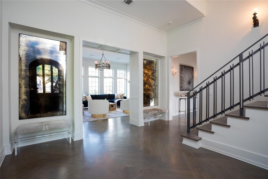 The foyer's Italian, antique crystal macaroni bead chandelier is one of a kind. 