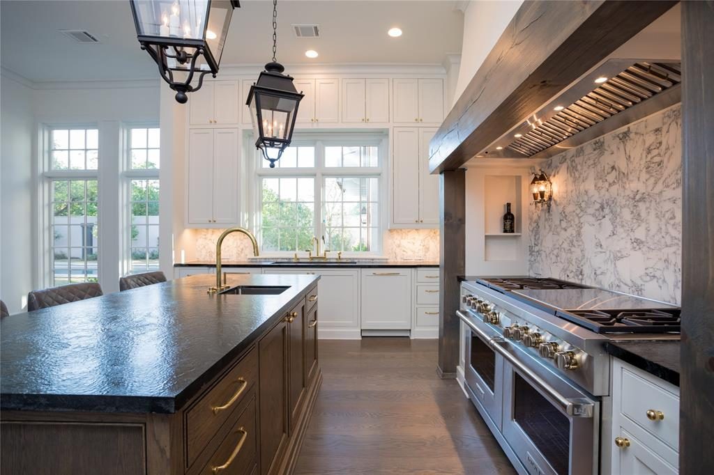 The kitchen has leathered soapstone counters. 