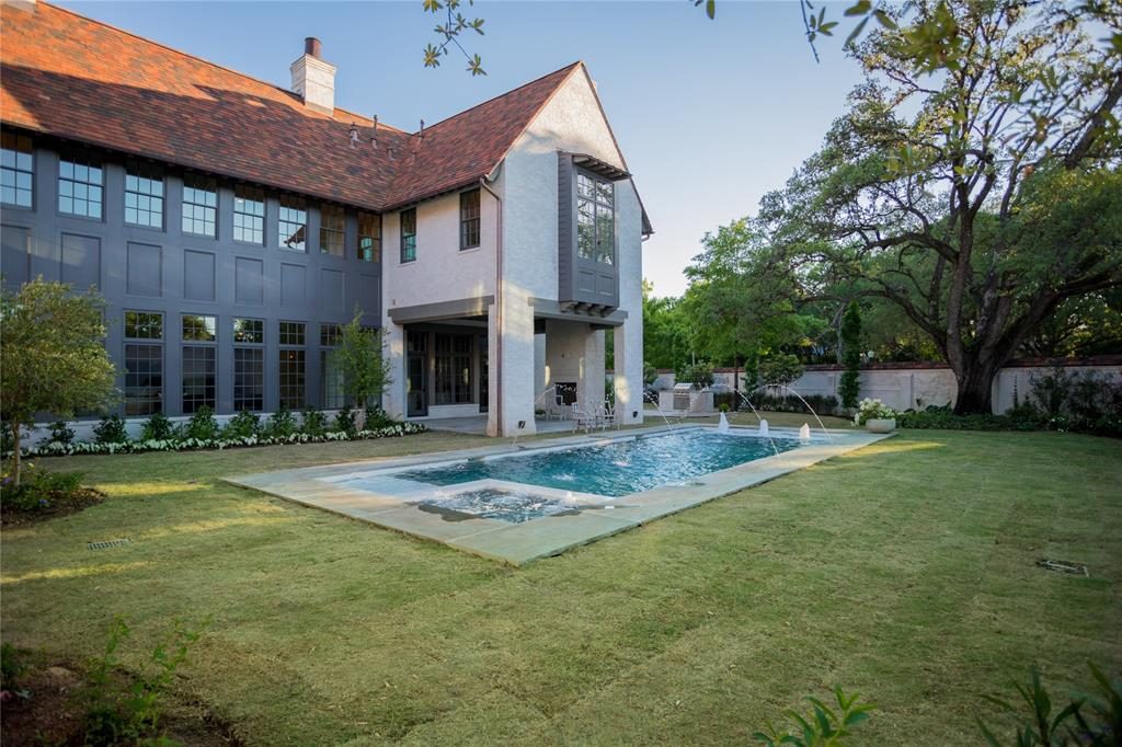 Gorgeous landscaping is reminiscent of Old River Oaks gardens. 