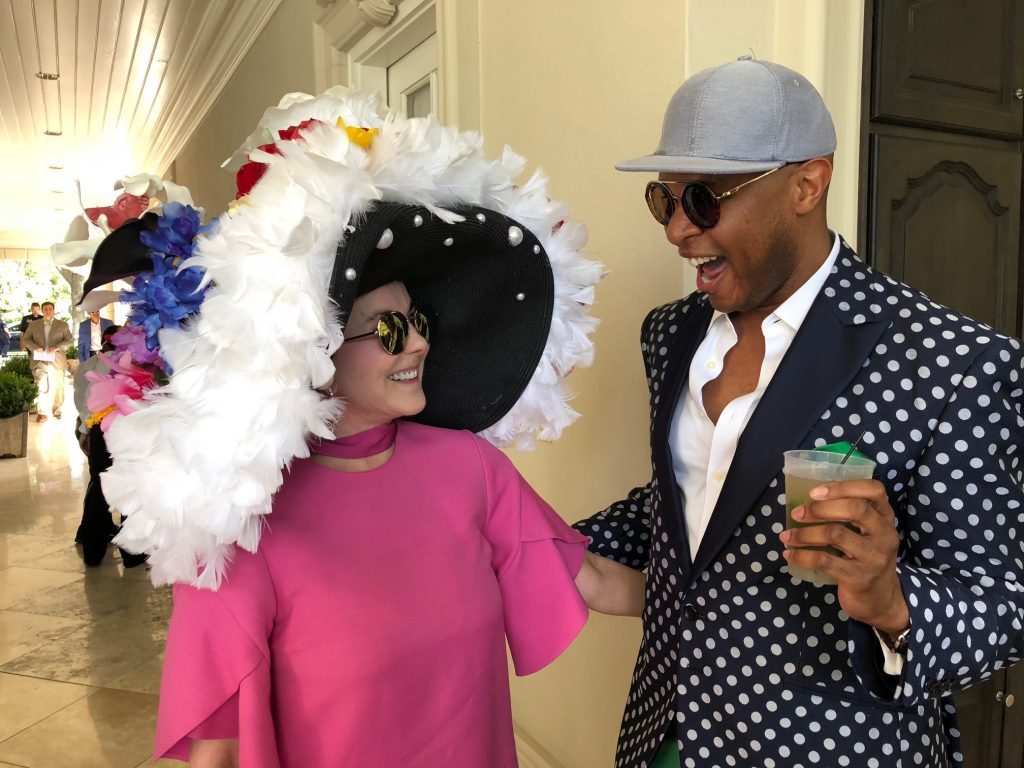 Sue Smith rocks the hat scene with Travis Torrence at the 2018 Hats, Hearts & Horseshoes benefit for Bo's Place. 