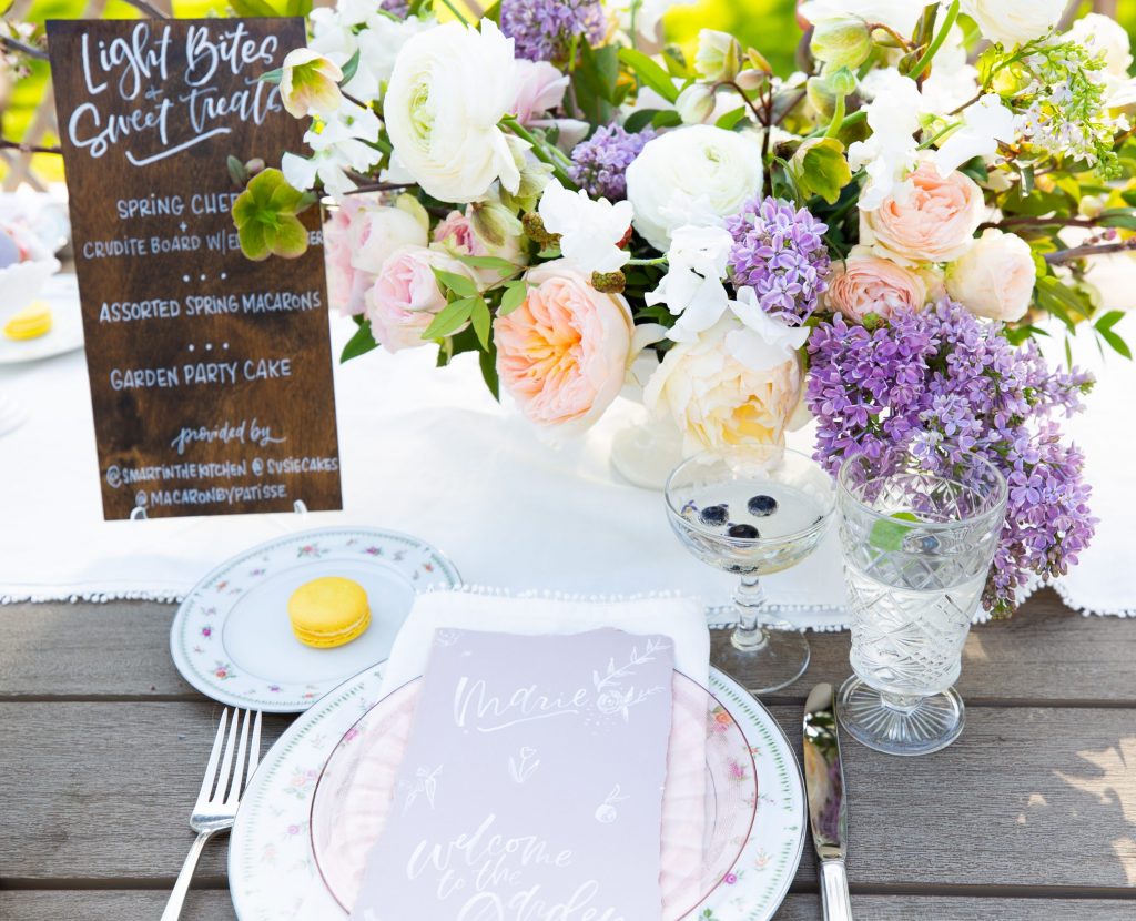 A menu calligraphed on a wood board by Meg Grant & Co adds a rustic touch.