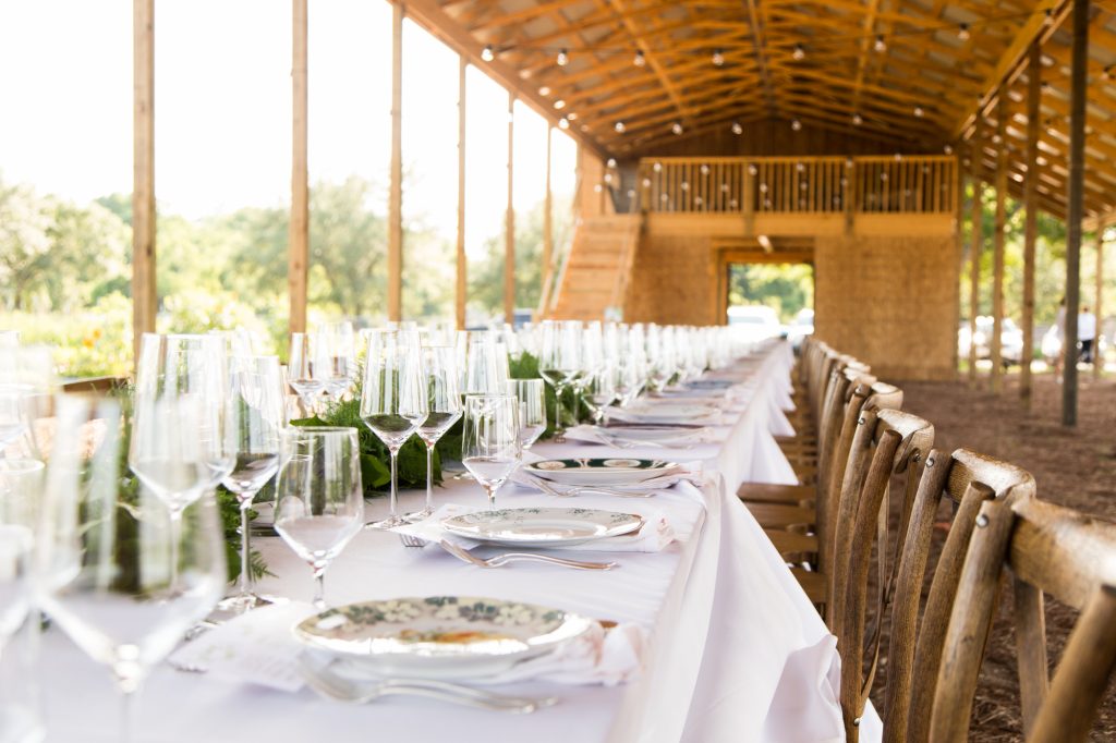 The dramatic long table sits pretty undernear the two-week old barn at Hope Farms 