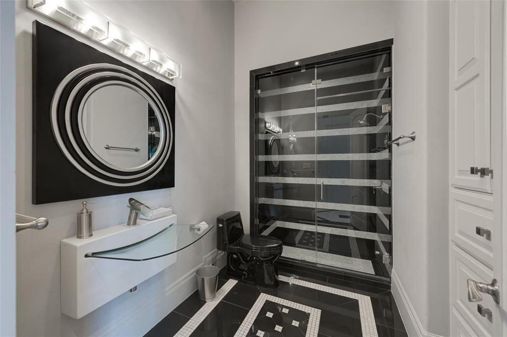 Black and white touches make for a bold bath. 