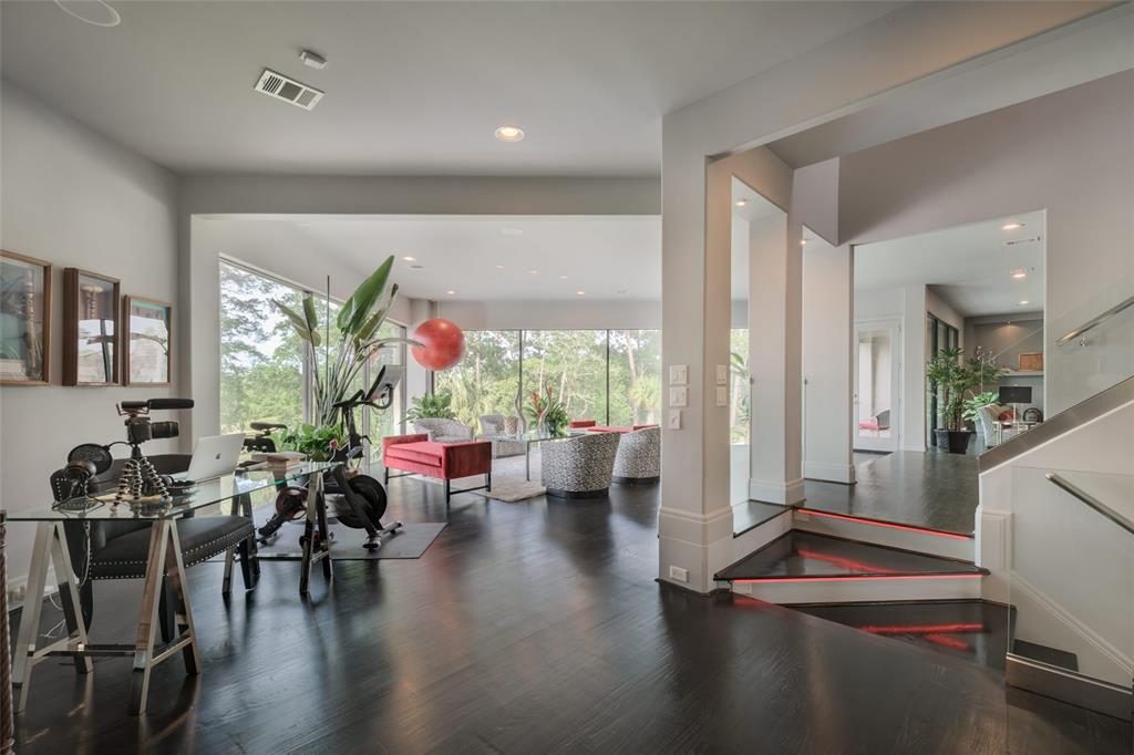 This surprising home office, actually space, resides in the middle of a second-floor open-plan home.