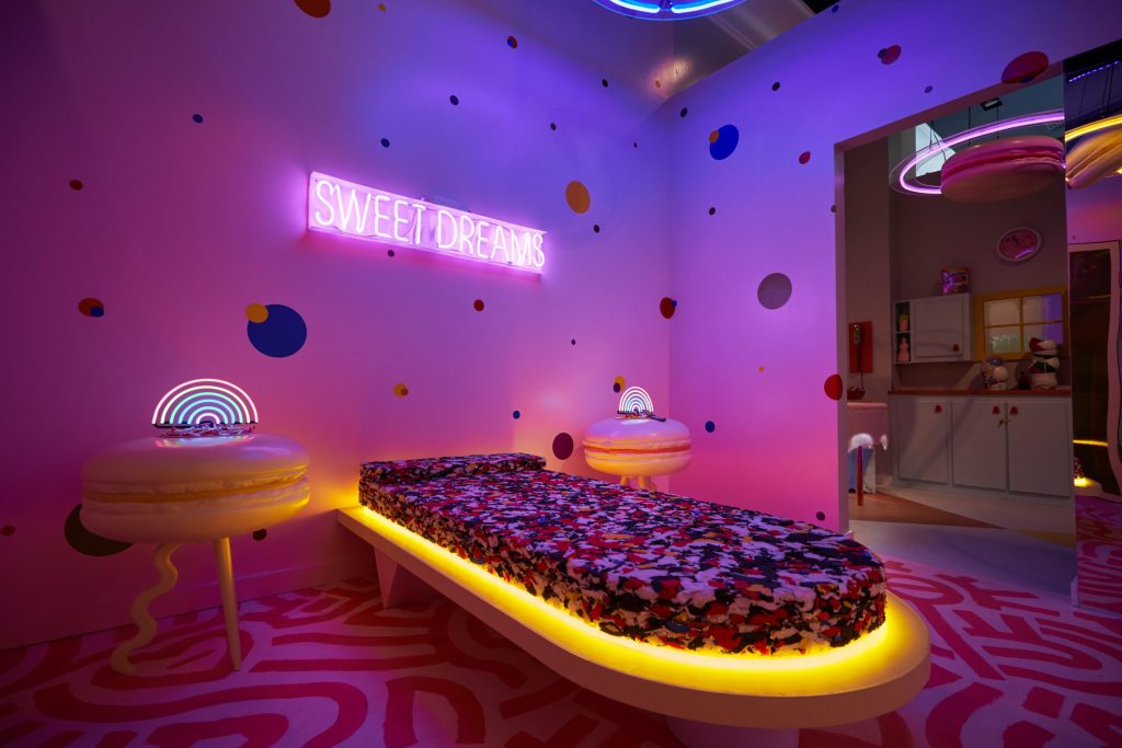 Robert Storey Studio uses lurid colours to light Nike pop-up shop