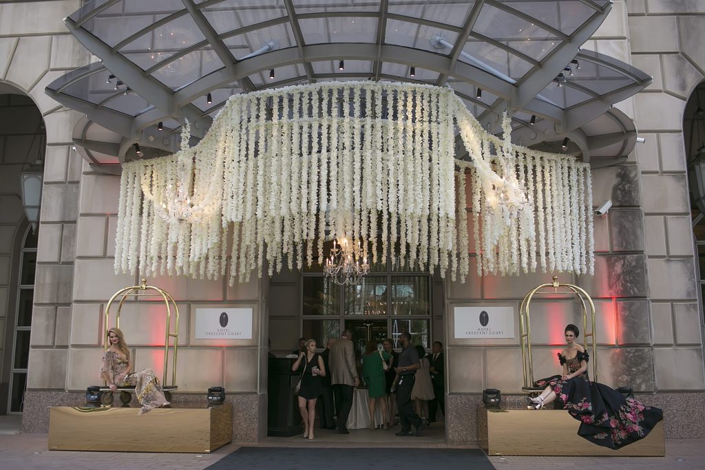 The hotel strung white blooms from the awnings and ceiling. 