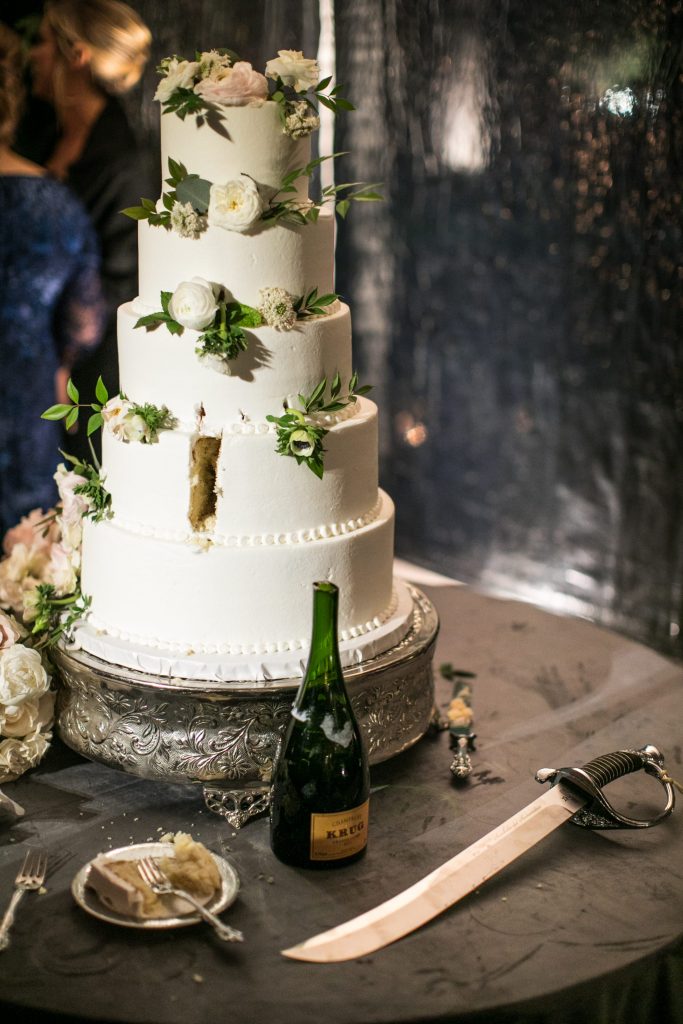 The five-tier wedding cake was the bride's childhood favorite: strawberry by The Cake Company (Photo by Samuel Lippke Studios)