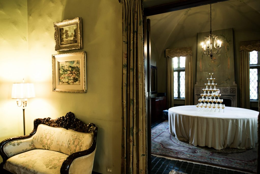 Champagne tower prepped for a celebratory toast, where the family Christmas tree used to stand (Photo by Samuel Lippke Studios)
