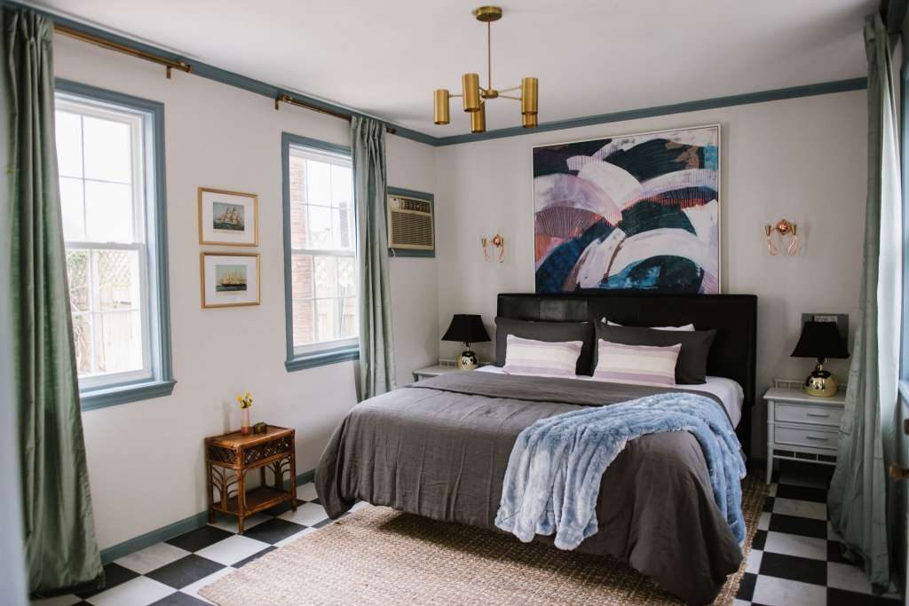 The carriage house room marries green trim with a purple palette. 