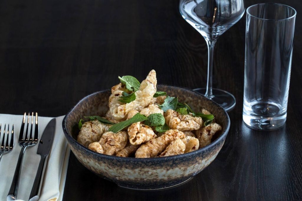 Poitin's pork skins make a happy hour statement. (Photo by Trevor Gerland.)
