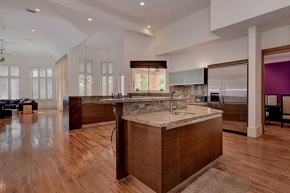 The sleek kitchen features imported granite counter tops. 