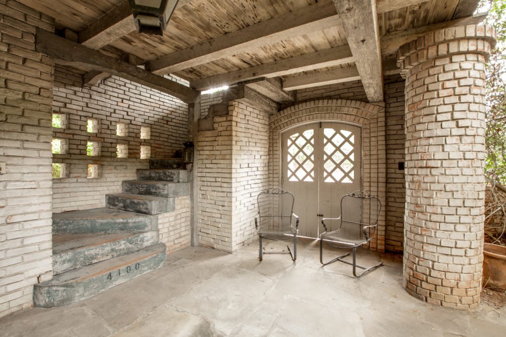 Courtyard of the 1937 Dilbeck duplex on University Blvd. and Preston Rd. shows Dilbeck's masterful interpretation of French farmhouse architecture. Courtesy Ebby Halliday Realtors