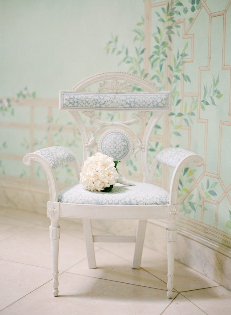 Ashley's slightly off-white wedding bouquet creates a stunning contrast with her gown. (Photo by Jose Villa)