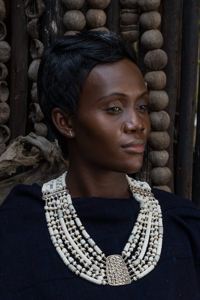 Kanju artisan with necklace of her design