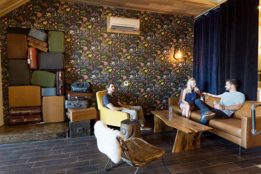 The stack of suitcases in the lobby is actually the entrance to Izkina, the neighboring bar. 