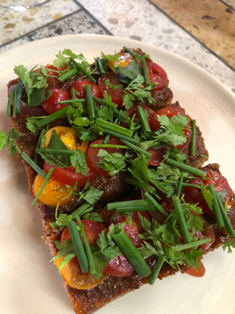 The Tomato Toast at Theodore Rex is a memorable dish.