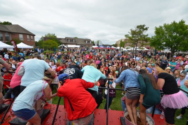 After grape stomping at the festival, you "sign" a souvenir T-shirt with your footprints. 