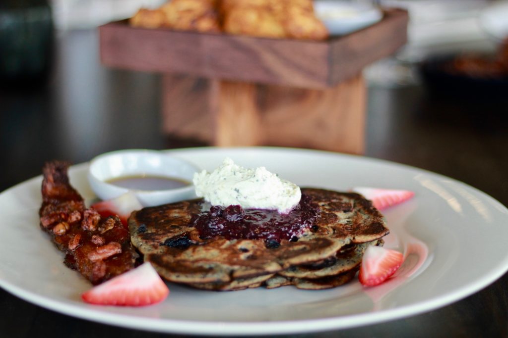Poitin's blueberriest buttermilk pancakes with candied bacon. (Photo by Victoria Christensen.)