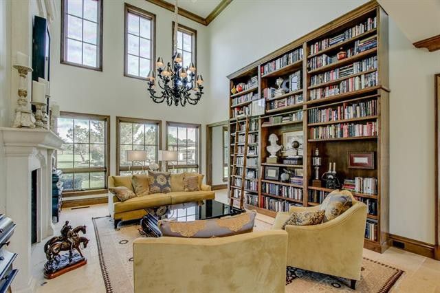 Tall rows of windows let natural light pour into the room. 