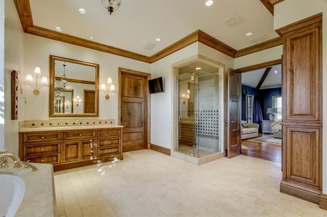 The glass and tile shower is a sleek alternative to the built-in bath. 