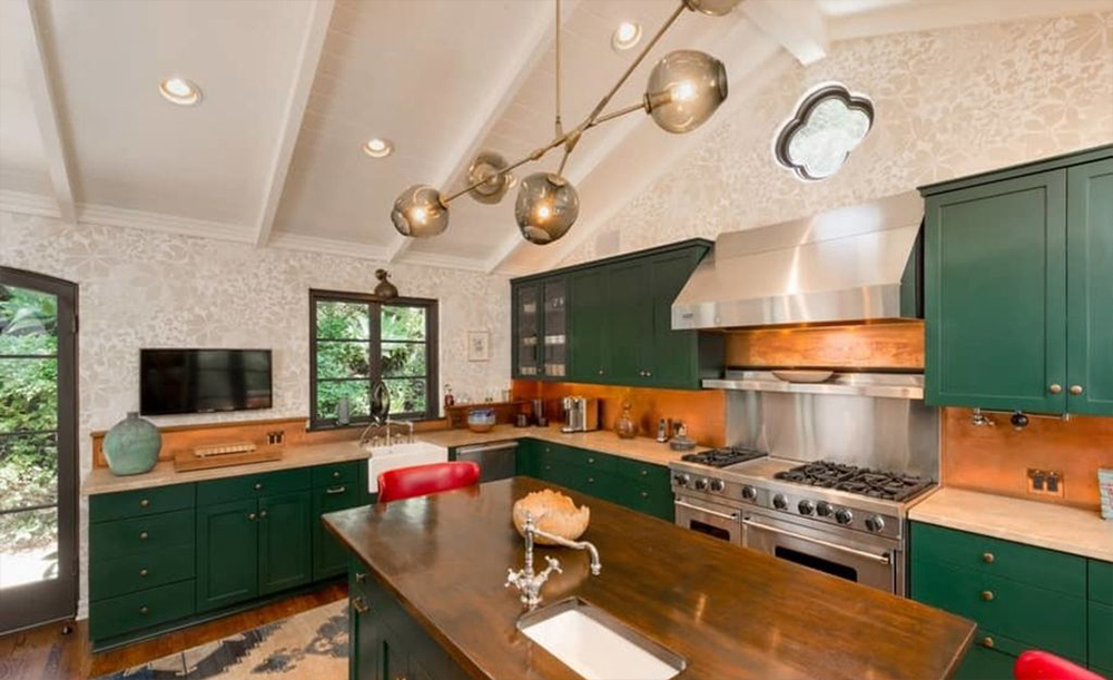 Green cabinetry is a welcome change of pace. 