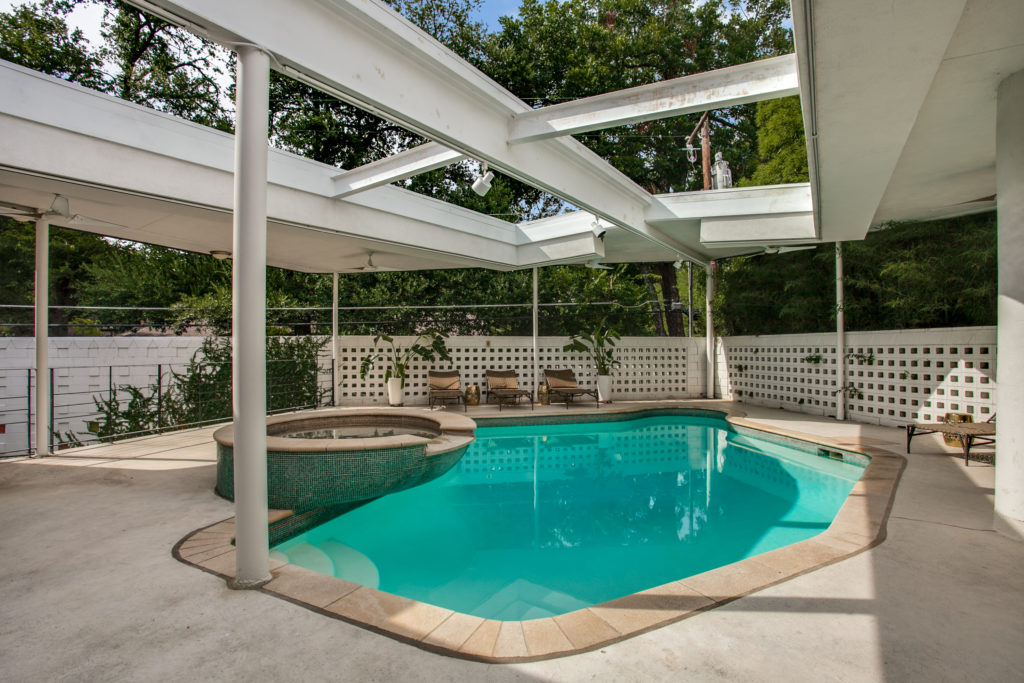 A pool and hot tub complete the backyard. 