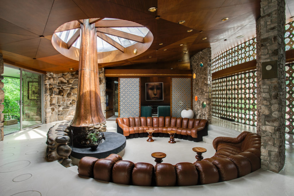 The unique chimney is a focal point of the living room.