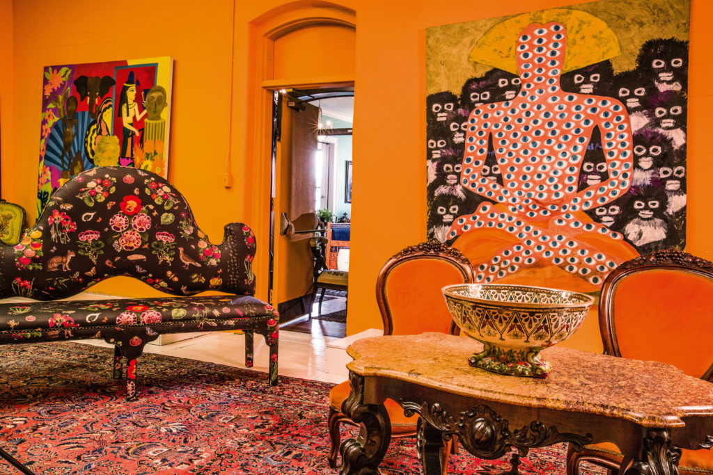 At the armory, Diana Vreeland's love of chintz and fiery colors was inspiration for the upholstery of the settee, discovered in Tennessee. (Photo Chris Bolton)