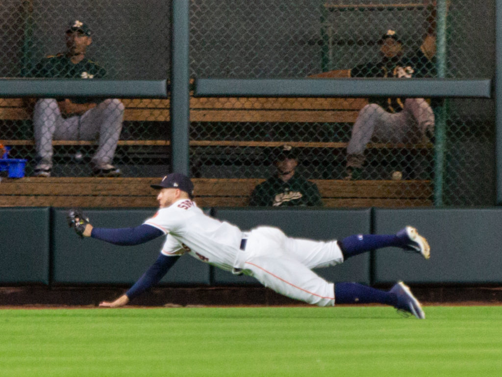 George Springer goes all out for every ball in the outfield. (Photo by F. Carter Smith.)
