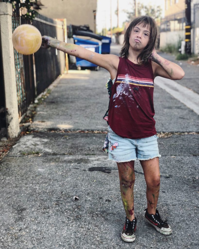 Sevy poses as she walks out of her first art show in L.A.