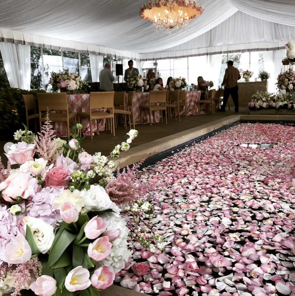 The over the top baby shower took place at The Ritz Carlton Hotel in Dallas. The tented area of the party boasted a fountain of flower petals in the middle.  (@toddevents)