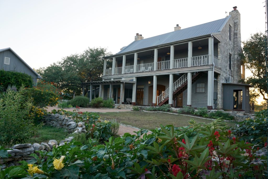 The main farmhouse holds the dining room, library, and a roomy back porch. 