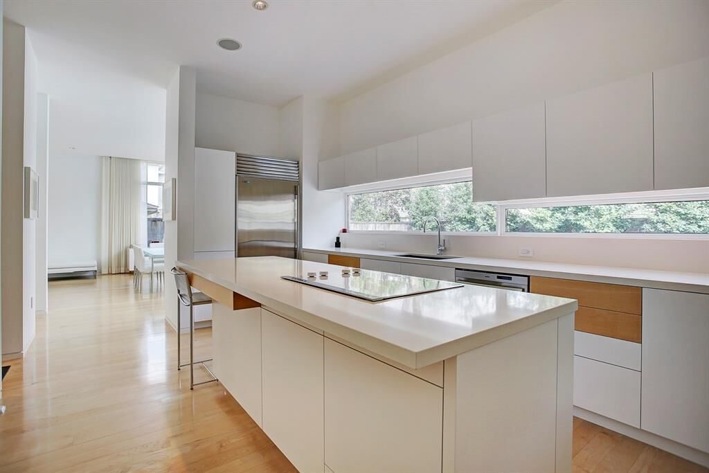 The kitchen at 6001 Charlotte is any chef's dream, with custom cabinetry, Bosh stainless appliances and Thassos Greek marble. 