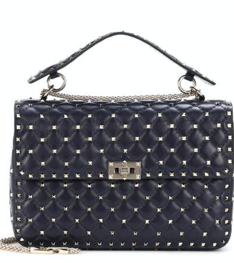 <a href=“http//www.thelittlebirdinc.com/collections/handbags/products/valentino-black-medium-rockstud-leather-shoulder-handbag”>Valentino Black Medium Rockstud Leather Shoulder Handbag, $1,295.</a>
