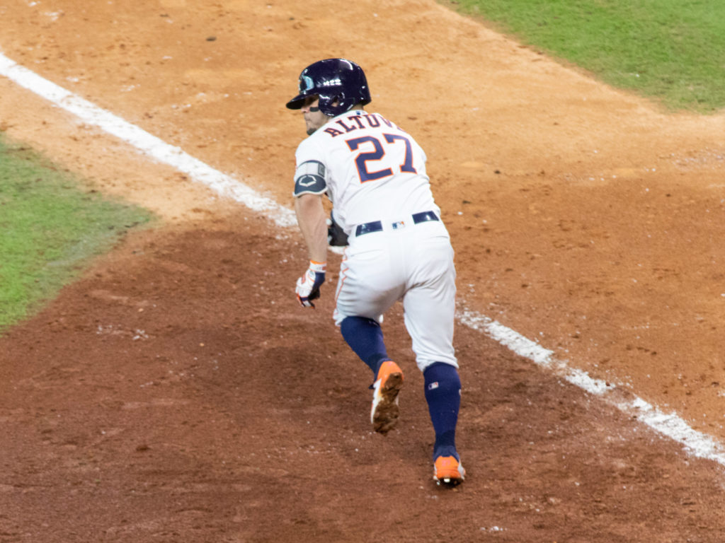Astros lifeline Jose Altuve came up limping on an infield single dash, but he played on. It's October. (Photo by F. Carter Smith.)