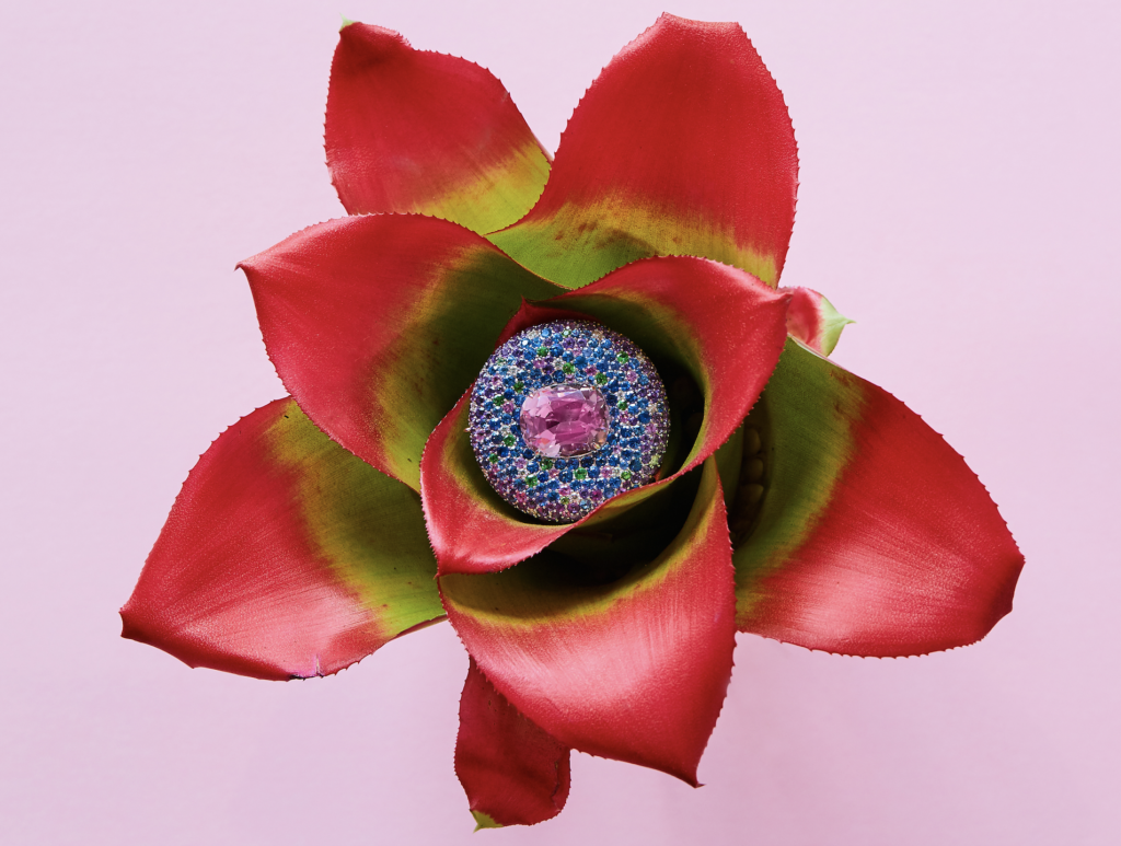 Large button earrings with centre kunzite surrounded by a myriad gemstones and diamonds in 18 karat white gold