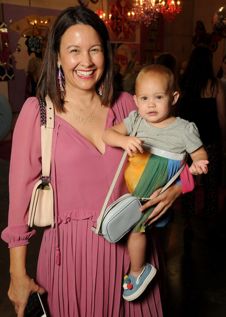 Carrie Colbert with Elle Hogan, 16 months, at an art sale and party with Ashley Longshore at The Post Oak Hotel Thursday Oct. 04,2018.(Dave Rossman photo)