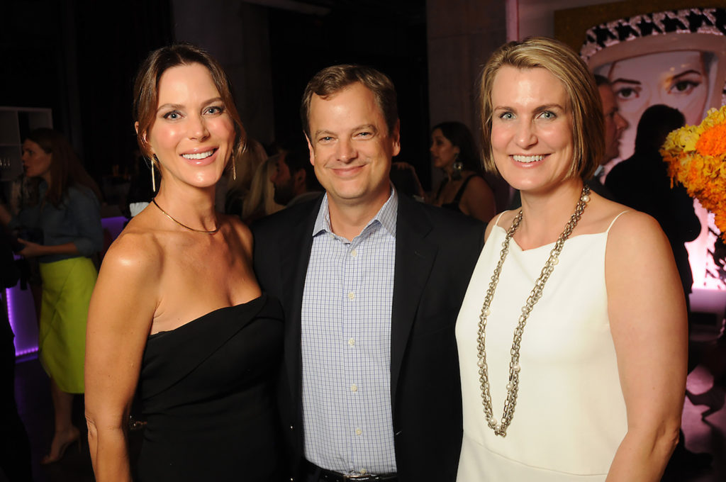 From left: Brenda and Brad Jones with Chandos Epley at an art sale and party with Ashley Longshore at The Post Oak Hotel Thursday Oct. 04,2018.(Dave Rossman photo)