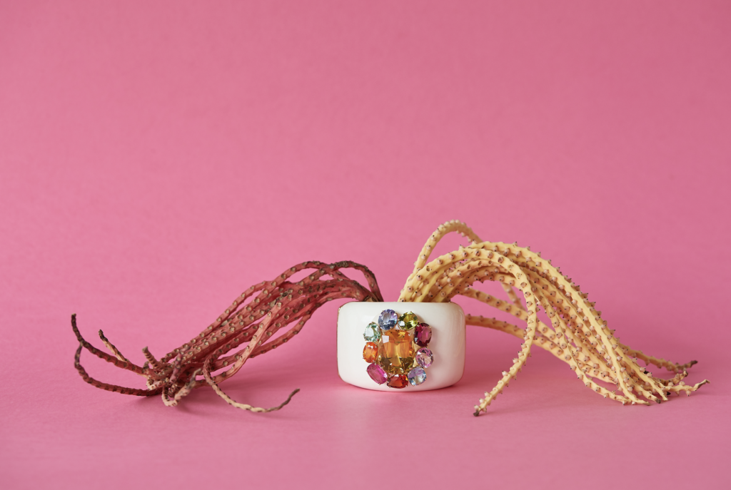 Mammoth cuff with Floral motif featuring center brilliant yellow beryl surrounded by a myriad of gemstones in 18 karat yellow gold