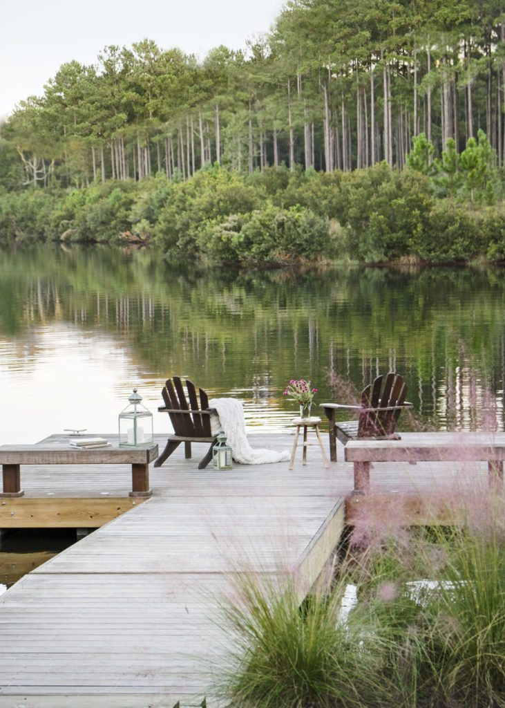 Docks are iconic in the Low Country, and the ultimate places to sit, have a drink, and watch the sun rise and set.A project from Suzanne Kasler: Sophisticated Simplicity. Photo by Erica George Dines.