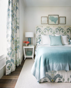 In this second-floor guest bedroom, we took a favorite, fun pattern and used it for the drapes, the headboard, and the dust skirt. A project from Suzanne Kasler: Sophisticated Simplicity. Photo by Erica George Dines.